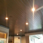 The lights on a wooden ceiling of a house