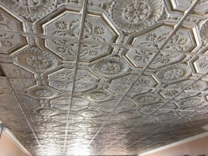 A tin and custom ceiling work with floral pattern