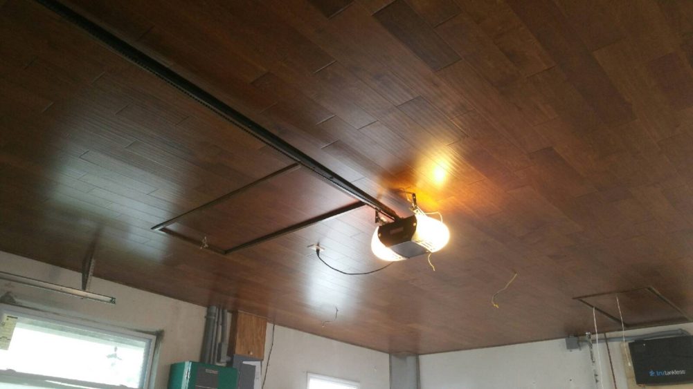 The light switched on a wooden ceiling