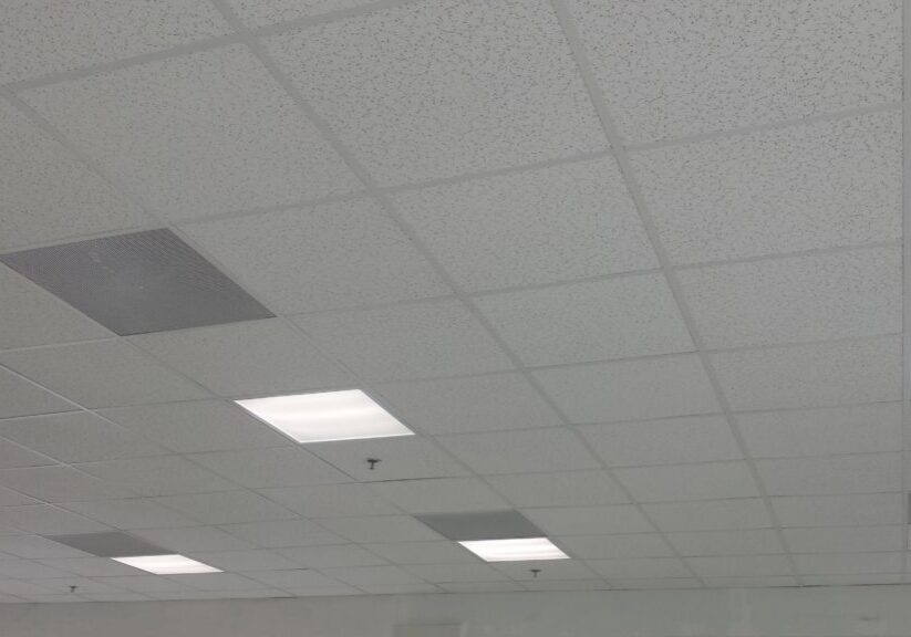 A padded ceiling with lights of a commercial building