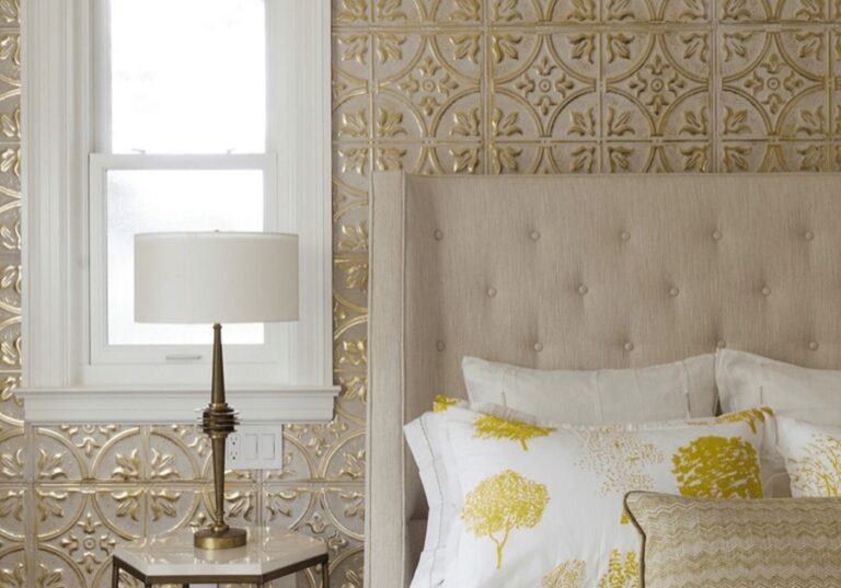 A bedroom with golden wallpaper and a bed